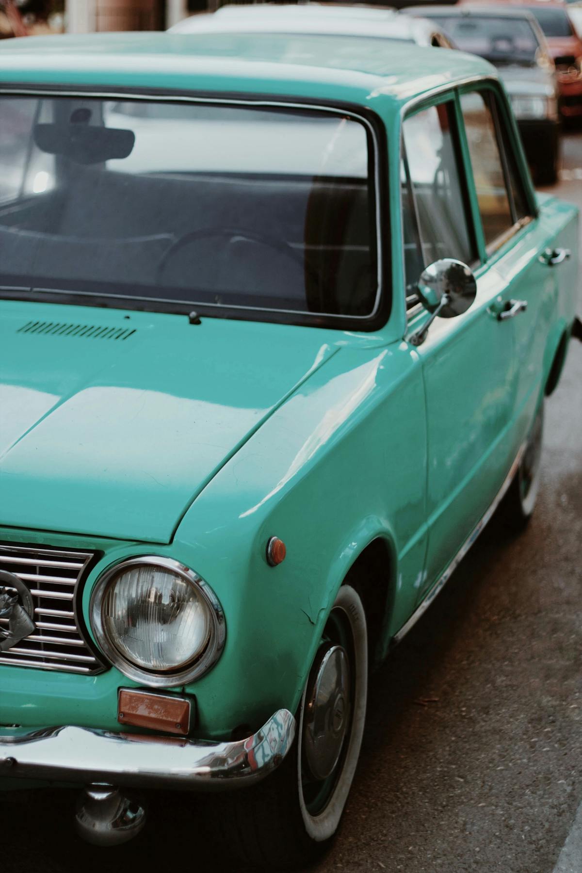 Classic teal sedan at a car show